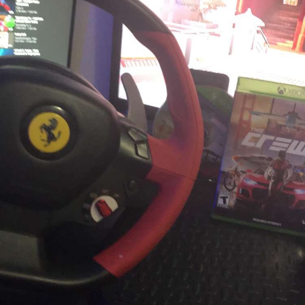 It a trust master steering wheel for Xbox 1 and it comes with forza4 and crew 2